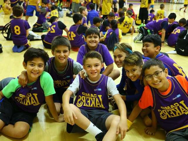 Camp Lakers kids smiling at camera.